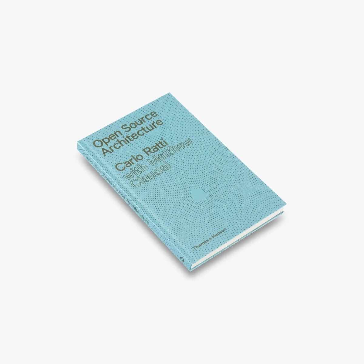 A copy of the book Open Source Architecture, a pale blue hardback patterned with dots that radiate from a small house.